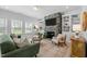 Inviting living room features a stone fireplace, built-in shelving, and comfortable seating arrangements at 234 Macallan Dr, Burlington, NC 27215