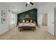 A spacious main bedroom features a vaulted ceiling, a decorative wall, and an attached bathroom with a glass-enclosed shower at 234 Macallan Dr, Burlington, NC 27215