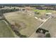 Panoramic aerial view of the sprawling lot featuring a home and extensive land suitable for various uses at 239 Surles Rd, Benson, NC 27504