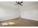 Bright bedroom with neutral paint, wood-look flooring, and lots of light at 239 Surles Rd, Benson, NC 27504