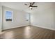 Bedroom with two windows provides ample natural light and a ceiling fan at 239 Surles Rd, Benson, NC 27504