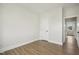 A simple bedroom with light walls and floors and a white door at 239 Surles Rd, Benson, NC 27504