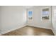 Bright bedroom featuring ample natural light from dual windows with beautiful exterior views at 239 Surles Rd, Benson, NC 27504