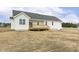 Back of home featuring wooden deck and light colored siding, great for outdoor relaxation at 239 Surles Rd, Benson, NC 27504