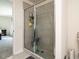 Bathroom featuring glass shower door with gray tile surround and a handheld shower head at 2575 Sheriff Watson Rd, Sanford, NC 27332
