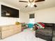 Bedroom featuring a ceiling fan, large TV, chest of drawers, and a large sectional sofa at 2575 Sheriff Watson Rd, Sanford, NC 27332