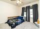 Bedroom featuring a blue monster truck themed bedspread, gray carpet and a window with dark drapes at 2575 Sheriff Watson Rd, Sanford, NC 27332