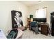 Bedroom with large Marilyn Monroe poster, a dark wood desk and chair and light-filled window at 2575 Sheriff Watson Rd, Sanford, NC 27332