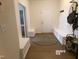 Welcoming foyer featuring built-in bench seating, a round rug, and access to other rooms in the home at 2575 Sheriff Watson Rd, Sanford, NC 27332