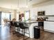 Modern kitchen featuring white cabinets, stainless steel appliances, granite countertops, and an island with seating at 2575 Sheriff Watson Rd, Sanford, NC 27332