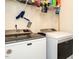 Laundry room with a Maytag washer and dryer and wire shelving to store laundry supplies at 2575 Sheriff Watson Rd, Sanford, NC 27332
