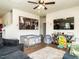 Inviting living room with a large TV, and a comfortable gray couch, and a plush rug at 2575 Sheriff Watson Rd, Sanford, NC 27332