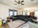 Open living room and dining area with modern decor, a sectional couch, and lots of sunlight at 2575 Sheriff Watson Rd, Sanford, NC 27332