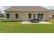 Exterior view of a backyard with a patio, furniture set, and grassy lawn at 274 Deodora Ln, Cameron, NC 28326