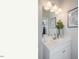 Bathroom vanity with white cabinets, sink, decorative items, and modern lighting at 274 Deodora Ln, Cameron, NC 28326