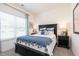 Inviting bedroom with soft, natural light, a decorative blue throw, and stylish bedside tables at 274 Deodora Ln, Cameron, NC 28326