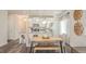 Dining area with view into the kitchen, featuring a dining table with a bench at 274 Deodora Ln, Cameron, NC 28326