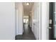 Well-lit entryway featuring hardwood floors, white walls, and a glimpse of the open living space at 274 Deodora Ln, Cameron, NC 28326