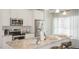 Stylish kitchen with stainless appliances, granite countertops, and bright white cabinets at 274 Deodora Ln, Cameron, NC 28326