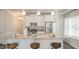 Bright, modern kitchen with granite counters, stainless appliances, and eat-in breakfast bar at 274 Deodora Ln, Cameron, NC 28326