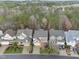 An aerial view showcases the neighborhood's tree-lined streets and well-maintained homes at 2803 Cameron Pond Dr, Cary, NC 27519