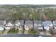 Picturesque aerial view of suburban homes surrounded by lush trees, offering a peaceful setting at 2803 Cameron Pond Dr, Cary, NC 27519