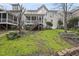 Expansive backyard featuring a deck with stairs to lush green space, ideal for entertaining at 2803 Cameron Pond Dr, Cary, NC 27519