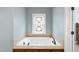 A luxurious soaking tub with a stained glass window at 2803 Cameron Pond Dr, Cary, NC 27519