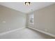 Cozy bedroom featuring neutral walls, carpeting, and a bright window at 2803 Cameron Pond Dr, Cary, NC 27519