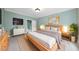 Well-lit bedroom featuring a minimalist bed, a light-colored carpet and bright window at 2803 Cameron Pond Dr, Cary, NC 27519