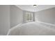 Bright bedroom with soft carpet, neutral walls, and large window, creating a peaceful atmosphere at 2803 Cameron Pond Dr, Cary, NC 27519