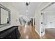 Elegant foyer featuring hardwood floors, a staircase, and open access to living spaces at 2803 Cameron Pond Dr, Cary, NC 27519