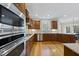 Modern kitchen featuring custom cabinetry, granite countertops, and stainless steel appliances at 2803 Cameron Pond Dr, Cary, NC 27519