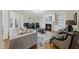 Spacious living room with a fireplace, built-in shelves, and comfortable seating at 2803 Cameron Pond Dr, Cary, NC 27519
