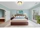 Calming main bedroom features soothing colors, carpet and bright window at 2803 Cameron Pond Dr, Cary, NC 27519