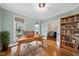 Bright office space featuring hardwood floors, a desk, and a view of the outdoors at 2803 Cameron Pond Dr, Cary, NC 27519