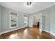 Bright office with hardwood floors, a large window, and French doors at 2803 Cameron Pond Dr, Cary, NC 27519