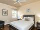 Cozy bedroom with neutral walls, carpeted floors, and a ceiling fan at 2813 Reynolda Cir, Durham, NC 27712