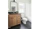 Full bathroom featuring a vanity, toilet, and tub shower combo at 2816 Cascadilla St, Durham, NC 27704