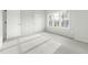 Light-filled bedroom featuring neutral carpeting, a window, and white doors at 2816 Cascadilla St, Durham, NC 27704