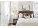 Comfortable bedroom with neutral décor, a large window, and a closet at 2816 Cascadilla St, Durham, NC 27704