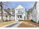 Charming light blue two-story home with white trim and inviting front yard at 2816 Cascadilla St, Durham, NC 27704