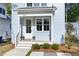 Charming entryway with a welcoming porch, lush greenery, and stylish fixtures at 2816 Cascadilla St, Durham, NC 27704