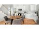 Well-lit kitchen with stainless steel appliances, and a cozy dining area at 2816 Cascadilla St, Durham, NC 27704