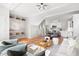 Open-concept living space with hardwood floors, built-in shelving, and modern lighting at 2816 Cascadilla St, Durham, NC 27704