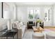 Bright living room with neutral tones, stylish furnishings, and ample natural light at 2816 Cascadilla St, Durham, NC 27704