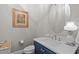 Elegant powder room features a blue vanity and modern fixtures at 2826 Walden Rd, Apex, NC 27502