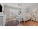 Comfortable main bedroom with a large window and hardwood floors at 2826 Walden Rd, Apex, NC 27502