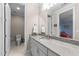 Bathroom with granite countertops, white cabinets, and an attached toilet and shower room at 3204 Cobblestone Ct, Raleigh, NC 27607