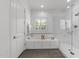 Bright bathroom featuring a soaking tub and glass enclosed shower at 3204 Cobblestone Ct, Raleigh, NC 27607
